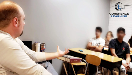 Teacher helping student